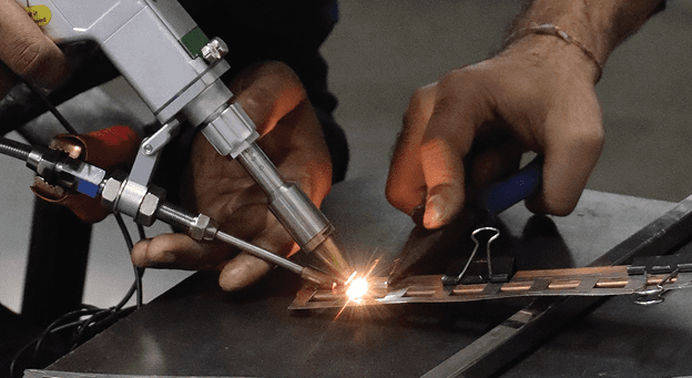 Offside Works TIG welding metal sheet closeup at fabrication workshop, Surat